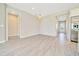 Spacious living area with open floor plan and tile flooring with an entrance to front door and a modern kitchen at 5215 Nw 34Th St, Ocala, FL 34482