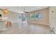 Open-concept living room with hardwood flooring and lots of natural light at 5215 Nw 34Th St, Ocala, FL 34482