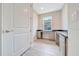 Bright office features gray cabinetry, granite countertops, and wood-look tile flooring at 5215 Nw 34Th St, Ocala, FL 34482