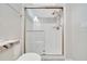 Modern shower boasts a glass door and sleek design with decorative tile accent at 5215 Nw 34Th St, Ocala, FL 34482