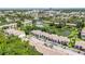 Beautiful aerial view of the community featuring lush landscaping, a tranquil pond, and a sparkling pool at 6 Escondido Cir # 55, Altamonte Springs, FL 32701