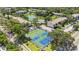 Aerial view featuring the community tennis courts, shuffleboard, and landscaping at 6 Escondido Cir # 55, Altamonte Springs, FL 32701