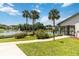 Beautifully landscaped community featuring a lake, pool, clubhouse, and walking paths at 6 Escondido Cir # 55, Altamonte Springs, FL 32701