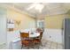 Charming dining area featuring a ceiling fan and seating for four in front of window at 6 Escondido Cir # 55, Altamonte Springs, FL 32701