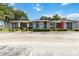 Clean exterior of the condo building with well-maintained landscaping and visible unit entrances at 6 Escondido Cir # 55, Altamonte Springs, FL 32701