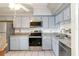 Galley kitchen with stainless steel appliances at 6 Escondido Cir # 55, Altamonte Springs, FL 32701