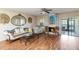 Inviting living room with hardwood floors, a decorative fireplace, and access to a screened lanai at 6 Escondido Cir # 55, Altamonte Springs, FL 32701