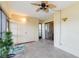 Enclosed sunroom featuring tiled floors, a ceiling fan, and large sliding glass doors at 6 Escondido Cir # 55, Altamonte Springs, FL 32701