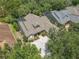 Beautiful aerial view of home with brick driveway and lush landscaping in established neighborhood at 600 Garden Club Dr, Deland, FL 32724