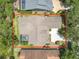 Bird's eye view of the property's roof, pool area, and surrounding greenery and landscaping at 600 Garden Club Dr, Deland, FL 32724