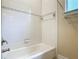 Bathroom with tub, shower, and large white tiles in the shower area at 600 Garden Club Dr, Deland, FL 32724