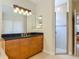 Bathroom with vanity and large glass-enclosed tiled shower stall at 600 Garden Club Dr, Deland, FL 32724
