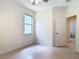 Neutral bedroom with tile flooring, closet, and natural light from the window at 600 Garden Club Dr, Deland, FL 32724