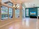 Bright and airy living room and dining area with many windows overlooking the outdoor patio at 600 Garden Club Dr, Deland, FL 32724