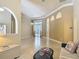 Bright living space features tiled floors, sliding glass doors, and archways at 600 Garden Club Dr, Deland, FL 32724