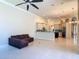 Open-concept living room and kitchen with great flow and bright lighting, perfect for entertaining at 600 Garden Club Dr, Deland, FL 32724