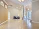 Expansive living room featuring a neutral palette, tiled floors, and decorative archways at 600 Garden Club Dr, Deland, FL 32724
