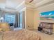 Main bedroom suite with tray ceiling and lanai access through sliding glass doors at 600 Garden Club Dr, Deland, FL 32724