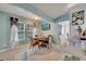 Cozy dining room featuring tile floors, a wooden table with seating for four, and bright natural light at 6017 Brookhill Ct, Orlando, FL 32810