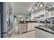 Modern kitchen featuring stainless steel appliances, dark countertops, and white cabinets at 6017 Brookhill Ct, Orlando, FL 32810