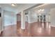 Spacious living room with hardwood floors, neutral paint, and ample natural light from the entryway at 6017 Brookhill Ct, Orlando, FL 32810