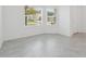 Bedroom with tile flooring, natural lighting, and neutral color palette at 6139 Claystone Way, Mount Dora, FL 32757