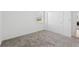 Cozy bedroom with carpet flooring, window with blinds, and closet for storage at 6139 Claystone Way, Mount Dora, FL 32757