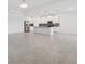 Open-concept living space with tile flooring, recessed lighting, and a chandelier at 6139 Claystone Way, Mount Dora, FL 32757