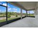 Spacious screened-in lanai for outdoor living and relaxing with a view of the landscape at 6139 Claystone Way, Mount Dora, FL 32757