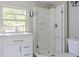 Bathroom showcasing a modern vanity with a marble countertop and glass enclosed shower at 6203 Candlewood Ln, Orlando, FL 32809