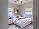 Cozy bedroom featuring neutral decor, wood floors, and a ceiling fan at 6203 Candlewood Ln, Orlando, FL 32809