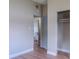 Neutral bedroom featuring wood-look floors and closet at 6203 Candlewood Ln, Orlando, FL 32809