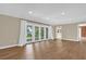 Open living room with hardwood flooring and natural light at 633 Balmoral Rd, Winter Park, FL 32789