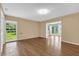 Spacious living room featuring hardwood floors and a large window at 633 Balmoral Rd, Winter Park, FL 32789