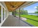 Screened-in porch with wood flooring and ceiling fans overlooking lake view at 633 Balmoral Rd, Winter Park, FL 32789