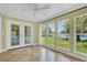 Bright sunroom featuring many windows and a tile floor at 633 Balmoral Rd, Winter Park, FL 32789