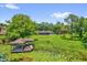 Beautiful waterfront property with boat dock and lush landscape overlooking tranquil lake at 633 Balmoral Rd, Winter Park, FL 32789