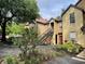 Townhome with garden area and exterior stairway at 6400 Raleigh St # 3015, Orlando, FL 32835