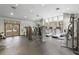 A bright gym featuring state-of-the-art equipment, treadmills, and ample natural light at 6400 Raleigh St # 3015, Orlando, FL 32835