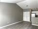Bright living space with neutral paint, hard surface floors, laundry closet, and modern kitchen at 6400 Raleigh St # 3015, Orlando, FL 32835