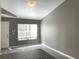 Bright living room featuring gray walls, hard surface floors, and natural light at 6400 Raleigh St # 3015, Orlando, FL 32835