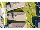 Aerial view of the home, surrounded by a well-maintained lawn and neighboring properties at 7745 Somersworth Dr, Kissimmee, FL 34747