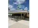 Outdoor bar and grill with casual seating and a full bar, perfect for poolside refreshments and dining at 7745 Somersworth Dr, Kissimmee, FL 34747