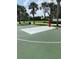 Outdoor basketball court surrounded by palm trees, perfect for a game at 7745 Somersworth Dr, Kissimmee, FL 34747
