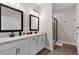 Bathroom boasts double sinks with granite countertops and a glass-enclosed shower at 7745 Somersworth Dr, Kissimmee, FL 34747