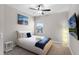 Comfortable bedroom with a large window, side table, sleek lighting and plush carpeting at 7745 Somersworth Dr, Kissimmee, FL 34747