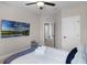 This bedroom offers a mounted TV, chair, and plush carpets for ultimate relaxation at 7745 Somersworth Dr, Kissimmee, FL 34747