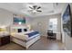 Bedroom features a plush bed, modern decor, and a workspace with desk and chair at 7745 Somersworth Dr, Kissimmee, FL 34747