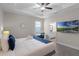 Bright bedroom featuring a bed, a desk and bathroom access at 7745 Somersworth Dr, Kissimmee, FL 34747