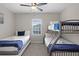 Comfortable bedroom with bunkbeds, twin beds, ceiling fan, and ample space for a Gathering or guests at 7745 Somersworth Dr, Kissimmee, FL 34747